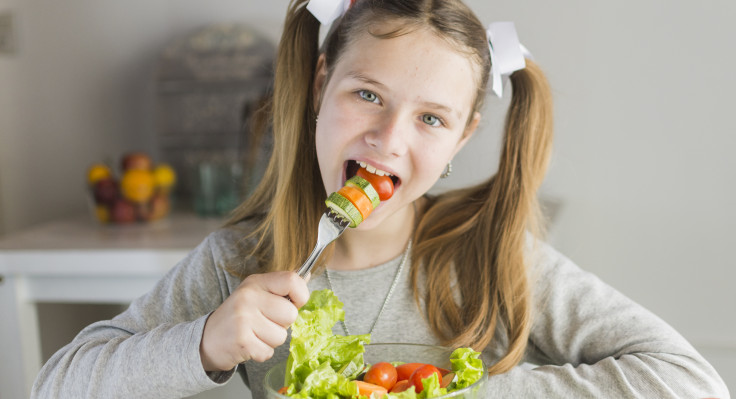 girl-eating-vegetable-salad-with-fork.jpg